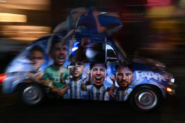 TOPSHOT - A car wrapped in images of Argentina's national football team players drives through Buenos Aires on July 11, 2026, ahead of the 2026 World Cup quarter-final match between Argentina and Switzerland. (Photo by Luis ROBAYO / AFP)