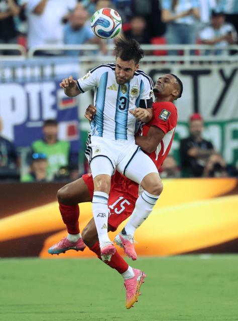 Argentina's defender #03 Nicolas Tagliafico and Switzerland's midfielder #15 Djibril Sow jump for a header during the 2026 World Cup football tournament quarter-final match between Argentina and Switzerland at the Kansas City Stadium in Kansas City on July 11, 2026.  (Photo by Thomas COEX / AFP)