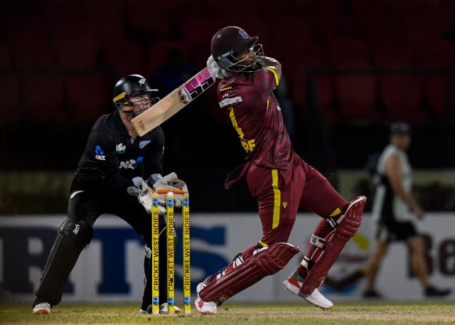 Shai Hope (R) of West Indies hits 6 during the first one-day international (ODI) cricket match between West Indies and New Zealand at Guyana National Stadium in Providence, Guyana on July 11, 2026. (Photo by Randy Brooks / AFP)