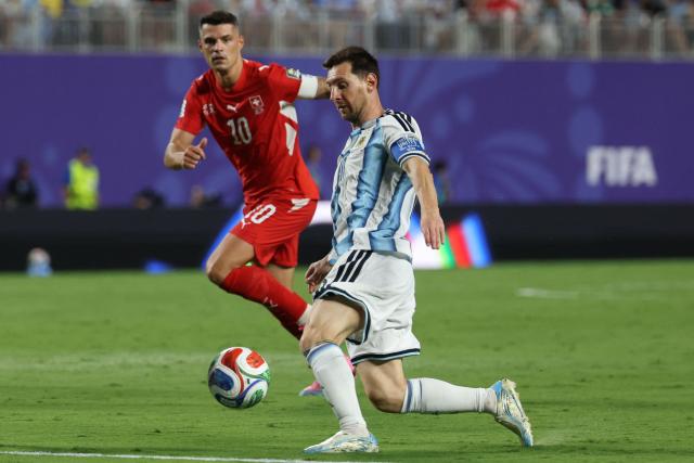 Argentina's forward #10 Lionel Messi controls the ball followed by Switzerland's midfielder #10 Granit Xhaka during the 2026 World Cup football tournament quarter-final match between Argentina and Switzerland at the Kansas City Stadium in Kansas City on July 11, 2026.  (Photo by Odd ANDERSEN / AFP)