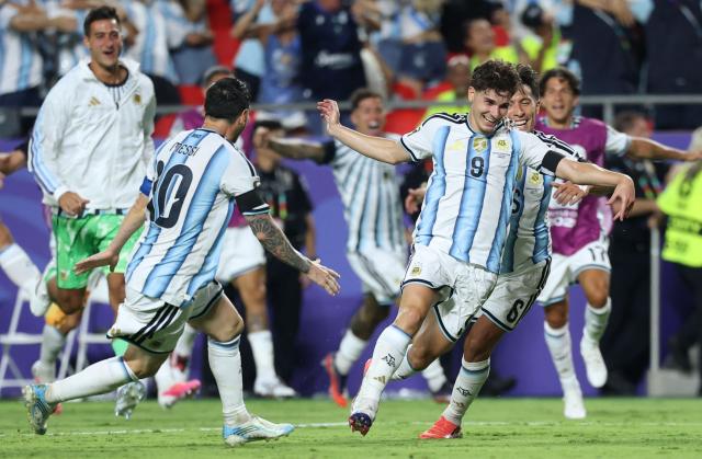 Argentina's forward #09 Julian Alvarez celebrates scoring his team's second goal with Argentina's forward #10 Lionel Messi and Argentina's defender #06 Lisandro Martinez during the 2026 World Cup football tournament quarter-final match between Argentina and Switzerland at the Kansas City Stadium in Kansas City on July 11, 2026.  (Photo by Thomas COEX / AFP)