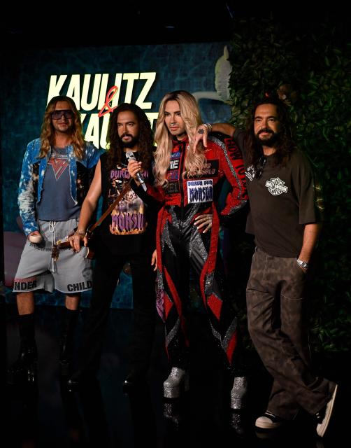 German musician Bill Kaulitz (L) and his twin brother Tom Kaulitz (R) from the German band "Tokio Hotel" pose with their wax likenesses during the unveiling of their figures at Madame Tussauds wax museum in Berlin on July 12, 2026. (Photo by Tobias SCHWARZ / AFP)