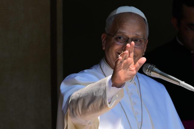 Pope Leo XIV greets the crowd at the end of the Angelus prayer from the entrance of the Apostolic Palace in Piazza della Liberta (Liberty Square) at the summer papal residence in Castel Gandolfo on 12 July 2026. (Photo by Tiziana FABI / AFP)