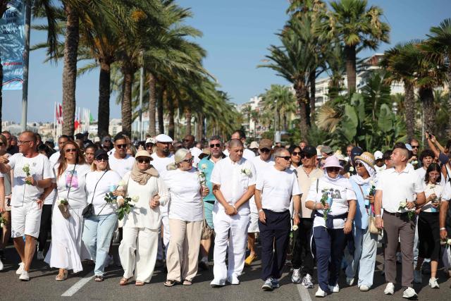 TOPSHOT - Relatives of victims killed in an attack in Nice on July 14, 2016, attend a commemorative walk on the "Promenade des Anglais" on the French riviera city of Nice on July 12, 2026. A solemn march, an interfaith ceremony, a military parade and a memorial service presided over by French President are on the programme for the commemorations marking the 10th anniversary of the attack on the Promenade des Anglais in Nice, as announced by the city council on July 1, 2026.
On July 14, 2016, Mohamed Lahouaiej-Bouhlel, a Tunisian national, drove a 19-tonne lorry for nearly 2 km into the crowd that had just been watching the fireworks, killing 86 people and injuring more than 400 before he was shot dead. (Photo by Valery HACHE / AFP)
