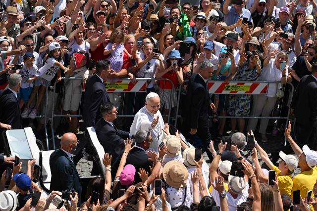 Pope Leo XIV greets the crowd after the Angelus in Piazza della Liberta (Liberty Square) at the summer papal residence in Castel Gandolfo on 12 July 2026. (Photo by Tiziana FABI / AFP)