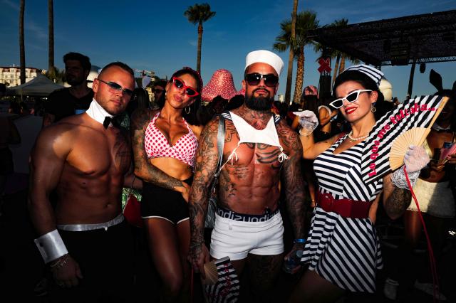 People take part in the "Bal des fous" festive event at the Palais des Festivals in Cannes, French Riviera, on July 12, 2026. (Photo by Valery HACHE / AFP)