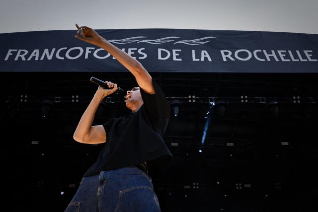 French-Rwandan singer, rapper and writer Gaël Faye, winner of the 2024 Renaudot literary prize for his novel "Jacaranda", performs on the Jean-Louis Foulquier stage during the 42nd Francofolies music festival, in La Rochelle, western France, on July 12, 2026. Created in 1985, the festival is dedicated to French-language and francophone music and runs until July 14, 2026. (Photo by Philippe LOPEZ / AFP)