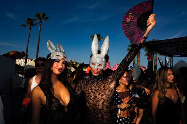 People take part in the "Bal des fous" festive event at the Palais des Festivals in Cannes, French Riviera, on July 12, 2026. (Photo by Valery HACHE / AFP)