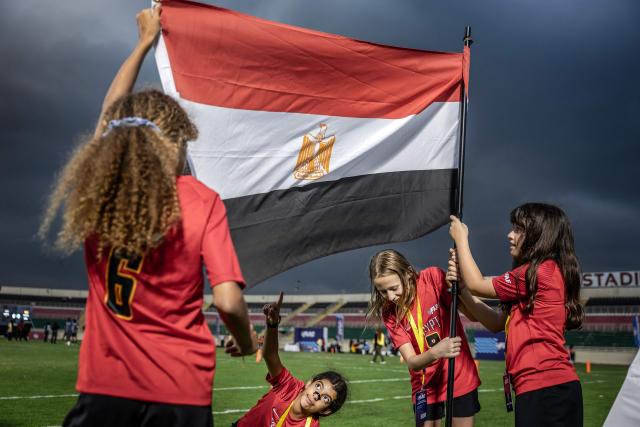 Players of Egypt’s national women’s junior flag football team hold an Egyptian flag as they celebrate the men’s senior team’s victory during the NFL Flag Africa Continental Championships at Nyayo Stadium in Nairobi on July 10, 2026. American Football's NFL came to Kenya this weekend for its latest competition on the African continent as it seeks to win converts to the sport. US sports have increasingly sought to break into the African market, with the NBA launching a high-profile Basketball Africa League in 2019, based in Rwanda.Recent days saw a third annual flag football competition staged by the National Football League (NFL) in Africa -- a non-contact version of the sport that has grown in popularity around the world and will make its Olympics debut at the 2028 Los Angeles Games. (Photo by Luis TATO / AFP)