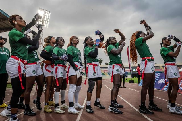 Players of Nigeria’s national women’s senior flag football team line up and chant before taking the field for their final game during the NFL Flag Africa Continental Championships at Nyayo Stadium in Nairobi on July 10, 2026. American Football's NFL came to Kenya this weekend for its latest competition on the African continent as it seeks to win converts to the sport. US sports have increasingly sought to break into the African market, with the NBA launching a high-profile Basketball Africa League in 2019, based in Rwanda.Recent days saw a third annual flag football competition staged by the National Football League (NFL) in Africa -- a non-contact version of the sport that has grown in popularity around the world and will make its Olympics debut at the 2028 Los Angeles Games. (Photo by Luis TATO / AFP)