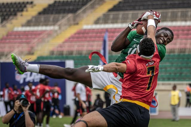 A player of Nigeria’s national men’s senior flag football team competes for the ball with a player from Egypt during their game at the NFL Flag Africa Continental Championships at Nyayo Stadium in Nairobi on July 10, 2026. American Football's NFL came to Kenya this weekend for its latest competition on the African continent as it seeks to win converts to the sport. US sports have increasingly sought to break into the African market, with the NBA launching a high-profile Basketball Africa League in 2019, based in Rwanda.Recent days saw a third annual flag football competition staged by the National Football League (NFL) in Africa -- a non-contact version of the sport that has grown in popularity around the world and will make its Olympics debut at the 2028 Los Angeles Games. (Photo by Luis TATO / AFP)