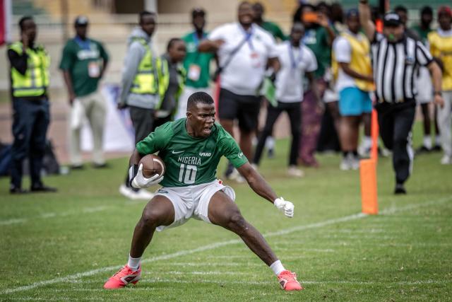 A player of Nigeria’s national men’s senior flag football team celebrates after scoring a touchdown against Egypt during their game at the NFL Flag Africa Continental Championships at Nyayo Stadium in Nairobi on July 10, 2026. American Football's NFL came to Kenya this weekend for its latest competition on the African continent as it seeks to win converts to the sport. US sports have increasingly sought to break into the African market, with the NBA launching a high-profile Basketball Africa League in 2019, based in Rwanda.Recent days saw a third annual flag football competition staged by the National Football League (NFL) in Africa -- a non-contact version of the sport that has grown in popularity around the world and will make its Olympics debut at the 2028 Los Angeles Games. (Photo by Luis TATO / AFP)