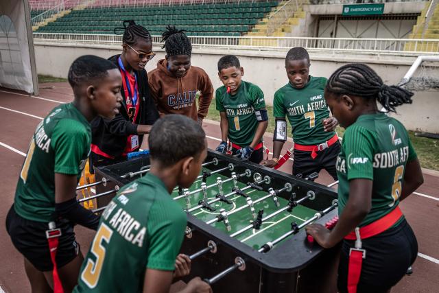 Players of South Africas national mixed junior flag football team play table football during a break at the NFL Flag Africa Continental Championships at Nyayo Stadium in Nairobi on July 10, 2026. American Football's NFL came to Kenya this weekend for its latest competition on the African continent as it seeks to win converts to the sport. US sports have increasingly sought to break into the African market, with the NBA launching a high-profile Basketball Africa League in 2019, based in Rwanda.Recent days saw a third annual flag football competition staged by the National Football League (NFL) in Africa -- a non-contact version of the sport that has grown in popularity around the world and will make its Olympics debut at the 2028 Los Angeles Games. (Photo by Luis TATO / AFP)