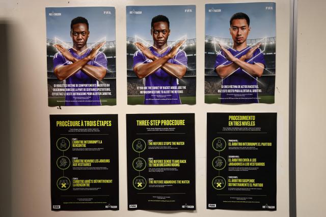 Posters show the FIFA three-step procedure against racism and discriminatory behaviour at the locker rooms of the Dallas Stadium in Arlington on July 12, 2026, ahead of the 2026 World Cup football tournament semi-final match between France and Spain on July 14.  (Photo by FRANCK FIFE / AFP)