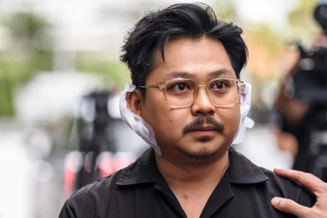 Athipat "Ice" Wijarn, whose band 'Tossakan' was performing when a fire broke out at the Rong Beer Na Lat Phrao bar, speaks to the media in Bangkok on July 13, 2026. A huge fire in a Bangkok bar killed at least 27 people and injured dozens, officials and witnesses said on July 13, the deadliest such incident in Thailand for almost two decades. (Photo by chanakarn LAOSARAKHAM / AFP)