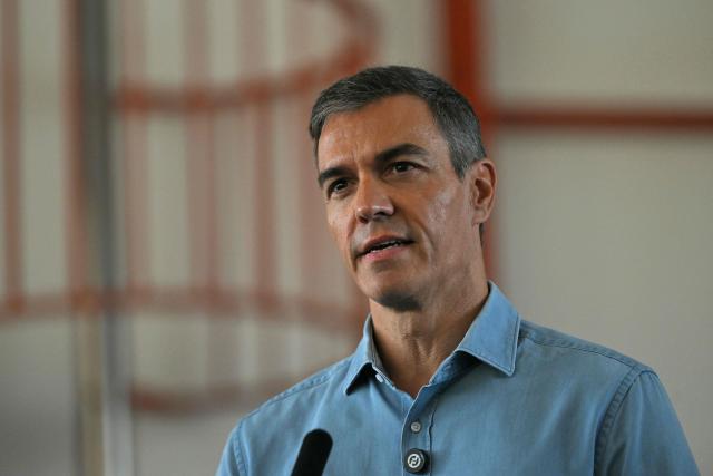 Spain's Prime Minister Pedro Sanchez talks to media during a visit in the area of a wildfire that killed at least 13 people, at the command post set in Turre, Almeria Province, on July 13, 2026. The toll from the deadly wildfires in southern Spain rose to 13 on July 12, 2026 after a British woman died of her injuries in hospital, officials in Andalusia region announced. (Photo by JORGE GUERRERO / AFP)