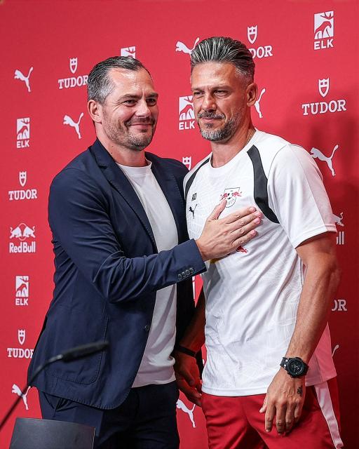 Argentinian coach Martin Demichelis (R) and RB Leipzig's sporting director Marcel Schaefer react during a press conference on Demichelis' presentation as Leipzig's new head coach at the training grounds of German first division Bundesliga football club RB Leipzig in Leipzig, eastern Germany on July 13, 2026. (Photo by Ronny HARTMANN / AFP)