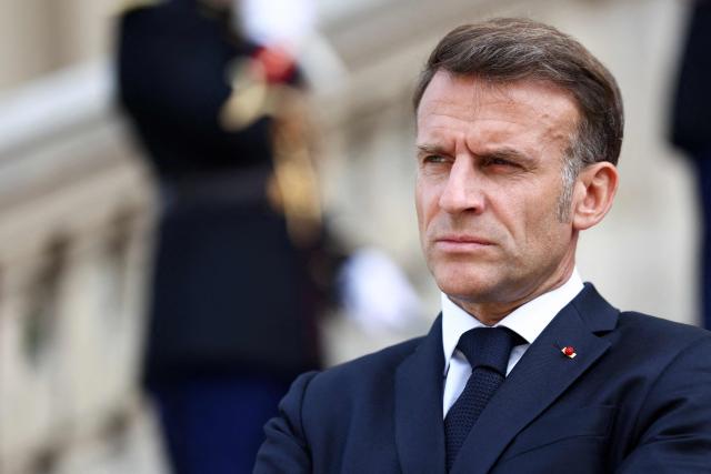 French President Emmanuel Macron waits for the arrival of Ukrainian President for the Integrated Anti-Ballistic Missile Coalition meeting ahead of a summit of the Coalition of the Willing to support Ukraine at the Hotel des Invalides in Paris on July 13, 2026. The summit meeting of the Coalition of the Willing -- launched by France and the United Kingdom to provide military support to Ukraine after Russia's full-scale invasion -- will push for a ceasefire and renewed peace talks, the French presidency said. (Photo by Tom Nicholson / POOL / AFP)