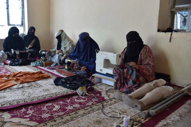 Afghan women sew clothes at a private training centre for the differently abled in Mazar-i-Sharif on July 13, 2026. (Photo by Atif ARYAN / AFP)
