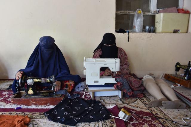Afghan women sew clothes at a private training centre for the differently abled in Mazar-i-Sharif on July 13, 2026. (Photo by Atif ARYAN / AFP)