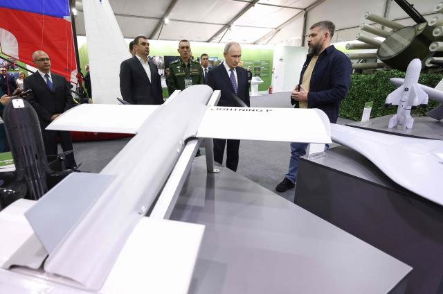 In this pool photograph distributed by the Russian state agency Sputnik, Russia's President Vladimir Putin tours an exhibition of the Everything for the Victory patriotic forum in Moscow on July 13, 2026. (Photo by Artem Geodakyan / POOL / AFP)