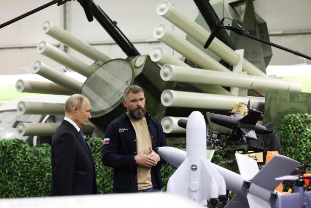 In this pool photograph distributed by the Russian state agency Sputnik, Russia's President Vladimir Putin tours an exhibition of the Everything for the Victory patriotic forum in Moscow on July 13, 2026. (Photo by Artem Geodakyan / POOL / AFP)