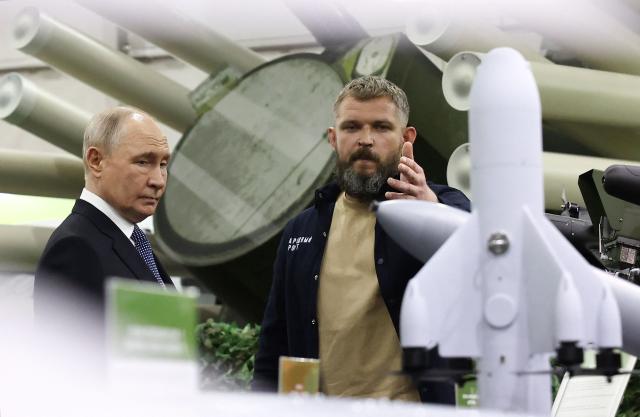 In this pool photograph distributed by the Russian state agency Sputnik, Russia's President Vladimir Putin tours an exhibition of the Everything for the Victory patriotic forum in Moscow on July 13, 2026. (Photo by Artem Geodakyan / POOL / AFP)