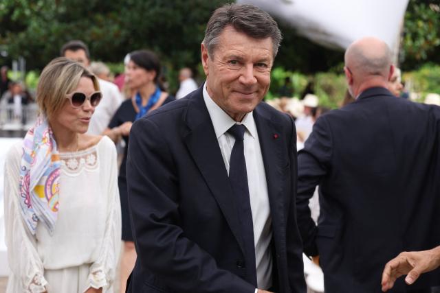 Former Nice mayor Christian Estrosi and his wife Laura Tenoudji arrive to attend an interfaith ceremony commemorating the victims of the July 14, 2016 attack, marking the 10th anniversary of the attack, in Nice, southeastern France, on July 13, 2026. (Photo by Valery HACHE / AFP)