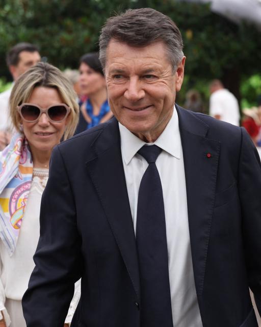 Former Nice mayor Christian Estrosi and his wife Laura Tenoudji arrive to attend an interfaith ceremony commemorating the victims of the July 14, 2016 attack, marking the 10th anniversary of the attack, in Nice, southeastern France, on July 13, 2026. (Photo by Valery HACHE / AFP)