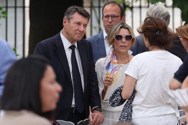 Former Nice mayor Christian Estrosi (L) and his wife Laura Tenoudji attend an interfaith ceremony commemorating the victims of the July 14, 2016 attack, marking the 10th anniversary of the attack, in Nice, southeastern France, on July 13, 2026. (Photo by Valery HACHE / AFP)