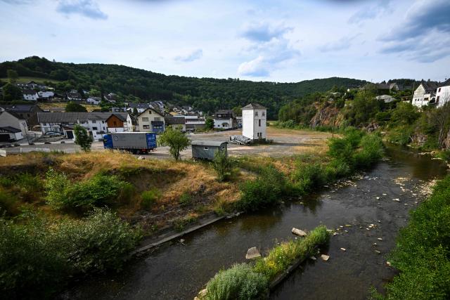 A photo shows an overview of the village with the Ahr river to mark the fifth anniversary of the floods in Rhineland-Palatinate and North Rhine-Westphalia in Schuld, western Germany on July 13, 2026. More than 180 people lost their lives in severe floods that pummelled western Germany in mid-July 2021, raising questions about whether enough was done to forewarn residents. (Photo by Ina FASSBENDER / AFP)