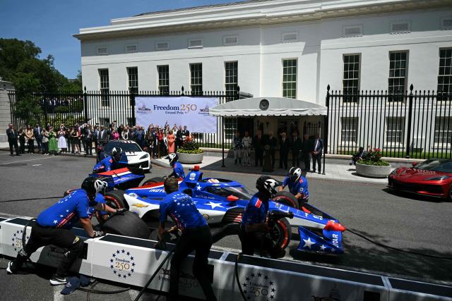 Mechanics work on  the car of US driver David Malukas outside the White House during a Freedom 250 Grand Prix Showcase in Washington, DC, on July 13, 2026. The Freedom 250 Grand Prix race will be the fifteenth round of the 2026 IndyCar Series. (Photo by SAUL LOEB / AFP)
