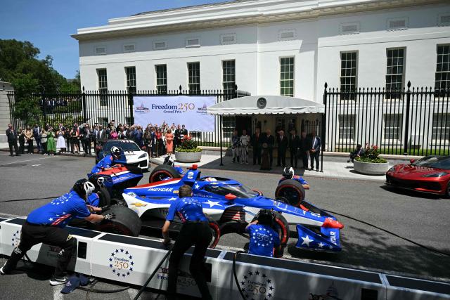 Mechanics work on  the car of US driver David Malukas outside the White House during a Freedom 250 Grand Prix Showcase in Washington, DC, on July 13, 2026. The Freedom 250 Grand Prix race will be the fifteenth round of the 2026 IndyCar Series. (Photo by SAUL LOEB / AFP)