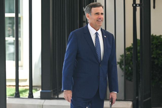 CIA Director John Ratcliffe looks on as US President Donald Trump hosts a Freedom 250 Grand Prix Showcase outside the White House in Washington, DC, on July 13, 2026. The Freedom 250 Grand Prix race will be the fifteenth round of the 2026 IndyCar Series, taking place on August 22-23 in Washington, DC. (Photo by SAUL LOEB / AFP)