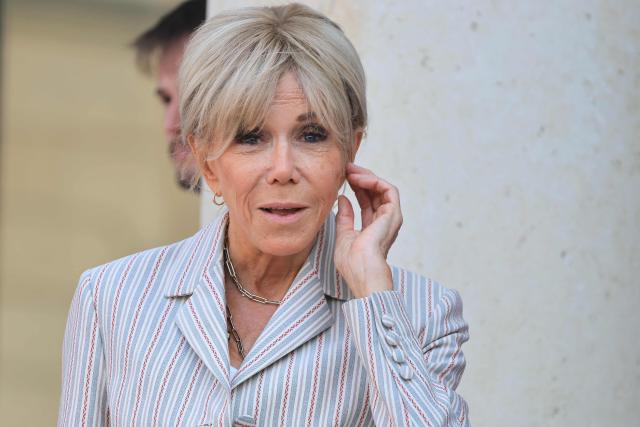 French President's wife Brigitte Macron gestures ahead of a dinner of the Coalition of the Willing to support Ukraine at The Elysee Presidential Palace in Paris on July 13, 2026. Macron is convening a summit in Paris of the Coalition of the Willing to support Ukraine - launched by France and the United Kingdom to provide military support to Ukraine after Russia's full-scale invasion - that will be attended by Ukraine's President, signaling the "strategic awakening" he seeks for Europe in the face of Russia and United States. (Photo by Ludovic MARIN / AFP)