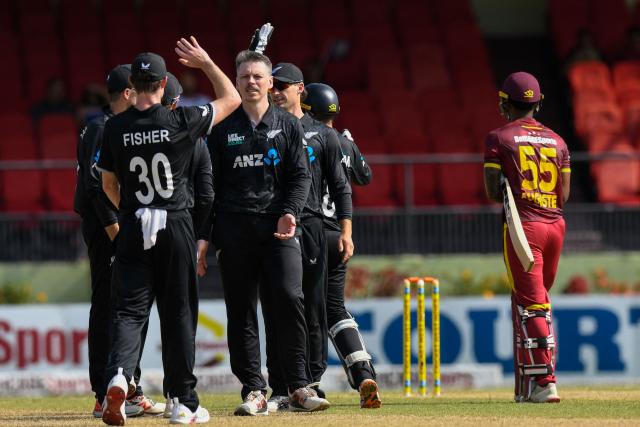 Michael Bracewell (2L) of New Zealand celebrates the dismissal of Akeem Auguste (R) of West Indies during the second one-day international (ODI) cricket match between West Indies and New Zealand at Guyana National Stadium in Providence, Guyana on July 13, 2026. (Photo by Randy Brooks / AFP)