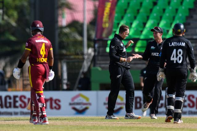 Jayden Lennox (3R) and Mitchell Santner (2R) of New Zealand celebrate the dismissal of Shai Hope (L) of West Indies during the second one-day international (ODI) cricket match between West Indies and New Zealand at Guyana National Stadium in Providence, Guyana on July 13, 2026. (Photo by Randy Brooks / AFP)