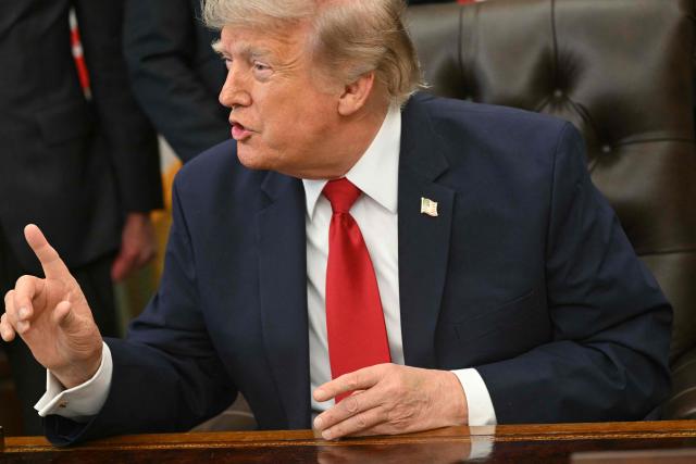 US President Donald Trump speaks after signing an executive order to drastically shrink two national monuments in Utah, paving the way for fossil fuel extraction and mining. (Photo by SAUL LOEB / AFP)