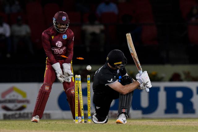 Dean Foxcroft (R) of New Zealand is bowled by Khary Pierre of West Indies during the second one-day international (ODI) cricket match between West Indies and New Zealand at Guyana National Stadium in Providence, Guyana on July 13, 2026. (Photo by Randy Brooks / AFP)