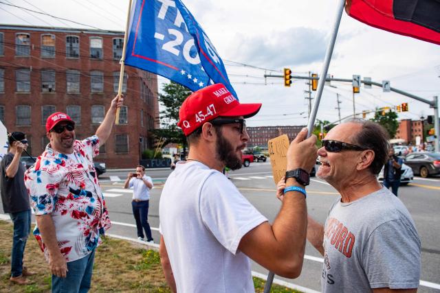 Supporters of US President Donald Trump and of ICE gather at a vigil for Joan Sebastian Guerrero who was fatally shot during an Immigration and Customs Enforcement (ICE) operation in Biddeford, Maine, on July 13, 2026. A US immigration officer on July 13, fatally shot a man identified by rights groups as a 26-year-old Colombian, an incident likely to fuel criticism of President Donald Trump's deportation drive. The shooting happened in Biddeford, a town of 22,000 people in the northern state of Maine, and comes a week after an Immigration and Customs Enforcement (ICE) agent shot dead a Mexican man in Texas. (Photo by Joseph Prezioso / AFP)