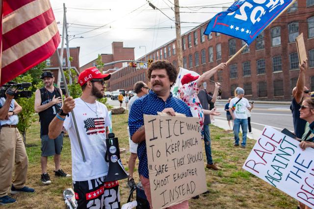 Supporters of US President Donald Trump and of ICE gather at a vigil for Joan Sebastian Guerrero who was fatally shot during an Immigration and Customs Enforcement (ICE) operation in Biddeford, Maine, on July 13, 2026. A US immigration officer on July 13, fatally shot a man identified by rights groups as a 26-year-old Colombian, an incident likely to fuel criticism of President Donald Trump's deportation drive. The shooting happened in Biddeford, a town of 22,000 people in the northern state of Maine, and comes a week after an Immigration and Customs Enforcement (ICE) agent shot dead a Mexican man in Texas. (Photo by Joseph Prezioso / AFP)