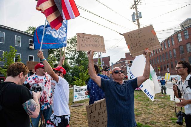 Supporters of US President Donald Trump and of ICE gather at a vigil for Joan Sebastian Guerrero who was fatally shot during an Immigration and Customs Enforcement (ICE) operation in Biddeford, Maine, on July 13, 2026. A US immigration officer on July 13, fatally shot a man identified by rights groups as a 26-year-old Colombian, an incident likely to fuel criticism of President Donald Trump's deportation drive. The shooting happened in Biddeford, a town of 22,000 people in the northern state of Maine, and comes a week after an Immigration and Customs Enforcement (ICE) agent shot dead a Mexican man in Texas. (Photo by Joseph Prezioso / AFP)