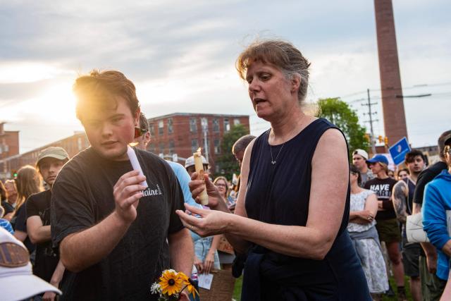 People light candles during a vigil honoring a 26-year-old Colombian man who was fatally shot during an Immigration and Customs Enforcement (ICE) operation in Biddeford, Maine, on July 13, 2026. A US immigration officer on July 13, fatally shot a man identified by rights groups as a 26-year-old Colombian, an incident likely to fuel criticism of President Donald Trump's deportation drive. The shooting happened in Biddeford, a town of 22,000 people in the northern state of Maine, and comes a week after an Immigration and Customs Enforcement (ICE) agent shot dead a Mexican man in Texas. (Photo by Joseph Prezioso / AFP)