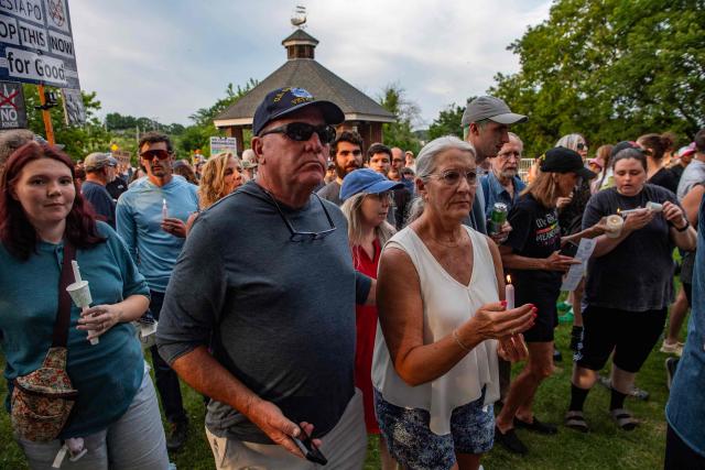 People participate in a peaceful walking vigil honoring a 26-year-old Colombian man who was fatally shot during an Immigration and Customs Enforcement (ICE) operation in Biddeford, Maine, on July 13, 2026. A US immigration officer on July 13, fatally shot a man identified by rights groups as a 26-year-old Colombian, an incident likely to fuel criticism of President Donald Trump's deportation drive. The shooting happened in Biddeford, a town of 22,000 people in the northern state of Maine, and comes a week after an Immigration and Customs Enforcement (ICE) agent shot dead a Mexican man in Texas. (Photo by Joseph Prezioso / AFP)