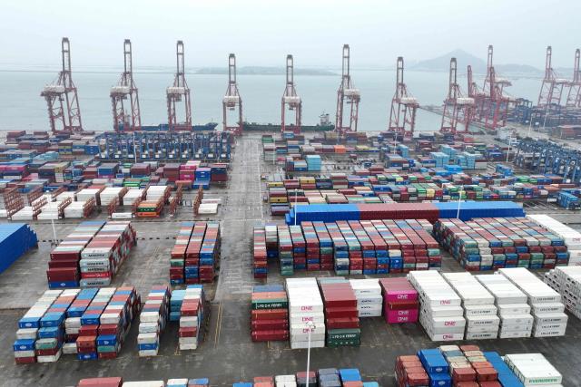Containers are seen at the port in Lianyungang, in China’s eastern Jiangsu province on July 14, 2026. Chinese exports jumped more than a quarter last month, official data showed on July 14, providing a fresh boost to leaders as they look to kickstart growth in the world's second-largest economy. (Photo by CN-STR / AFP) / China OUT