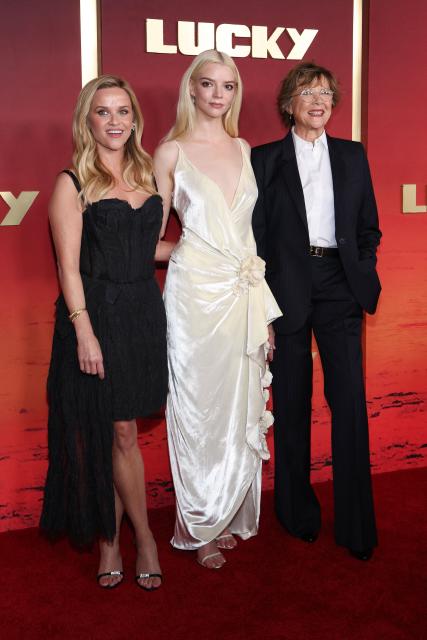 (L-R) US actress/executive producer Anya Taylor-Joy, US executive producer and actress  Reese Witherspoon and US actress Annette Bening attend Apple TV Limited Series premiere of "Lucky" at the Directors Guild of America in Los Angeles on July 13, 2026. (Photo by VALERIE MACON / AFP)