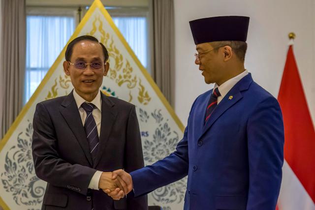 Indonesian Foreign Minister Sugiono (R) shakes hands with Vietnamese Foreign Minister Bui Thanh Son (L) during the Joint Commission for Bilateral Cooperation (JCBC) meeting at the Ministry of Foreign Affairs in Jakarta on July 14, 2026. (Photo by ADITYA IRAWAN / AFP)
