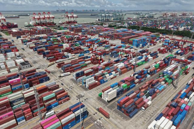 Containers are seen at the port in Shanghai on July 14, 2026. Chinese exports jumped more than a quarter last month, official data showed on July 14, providing a fresh boost to leaders as they look to kickstart growth in the world's second-largest economy. (Photo by CN-STR / AFP) / China OUT