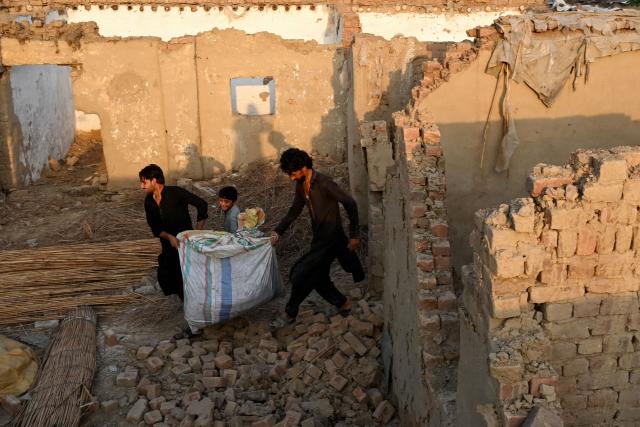 Afghan refugees collect building materials before their repatriation to Afghanistan, in Peshawar on July 14, 2026, after voluntary departure deadline for Afghan citizens without visas ended as part of an intensifying deportation drive. (Photo by Abdul MAJEED / AFP)
