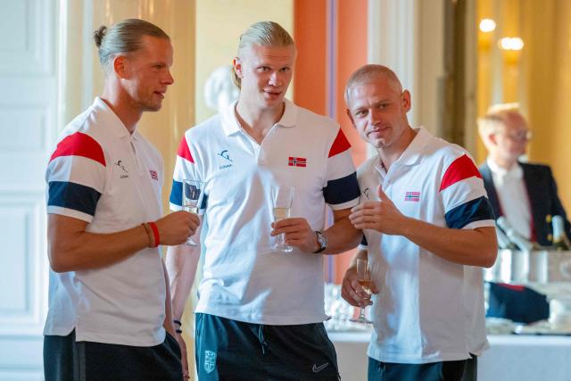 Norway's goalkeeper #01 Orjan Nyland (L) and Norway's forward #09 Erling Braut Haaland (C) attend a reception with the Royal family at the palace in Oslo after their return to Norway from the USA on July 13, 2026. Norway were knocked out in the quarter-final match against England. (Photo by Amanda Pedersen Giske / NTB / AFP) / Norway OUT